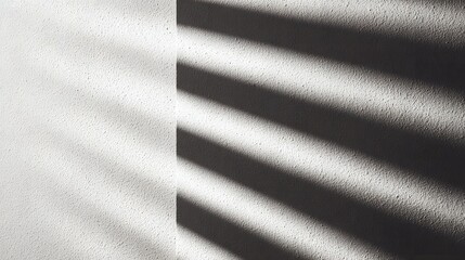 Textured white wall with diagonal shadow stripes and dappled light image