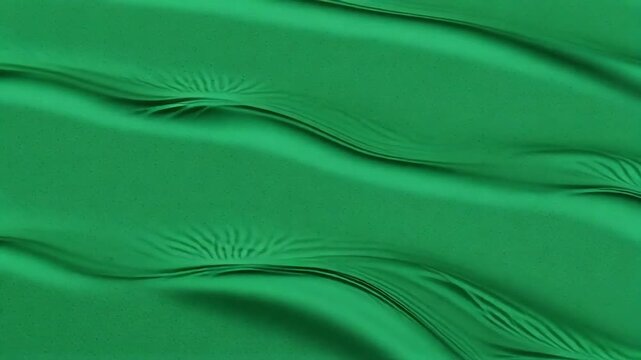 Dynamic emerald green liquid waves ripple and flow, creating mesmerizing abstract patterns and textures with subtle light play