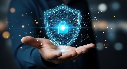 Closeup of a hand holding a glowing digital shield with a padlock icon, symbolizing data protection and cybersecurity