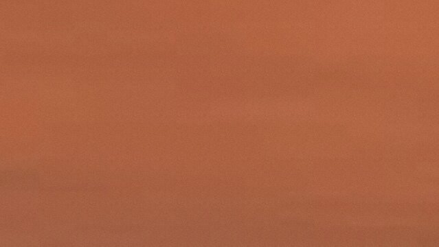 Textured background of warm earthy terracotta tones with subtle variations