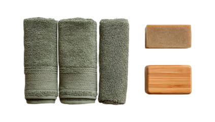 Three rolled up green towels with soap and a wooden soap dish isolated on transparent background