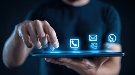 Person interacting with digital tablet showcasing communication icons.