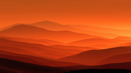 Obraz premium Vibrant orange mountain layers glow with warm sunset light creating a serene majestic landscape vista