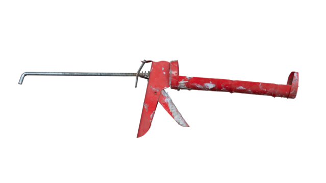 Used silicone gun has white silicone stains on the workpiece. Isolated on white background of textured.