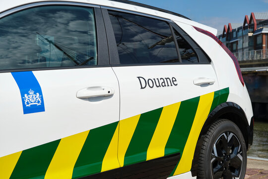 Dutch customs Douane car with douane sign on the side with green and yellow stripes, supervising the import, export and transit of goods in the Netherlands