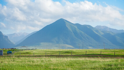 mountain landscape with blue sky and clouds