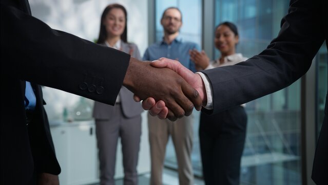 Businesspeople partners shaking hands handshake greeting cheering success deal financial offer client consumer business team multiethnic businesswomen businessmen agreement office cooperate coworking
