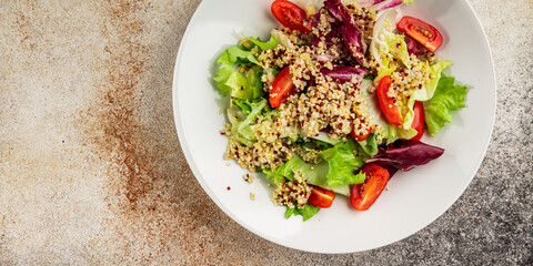 Quinoa salad tomato, green leaf salad vegetables dish natural product tasty snack fresh gourmet food background on the table rustic top view copy space keto and paleo diet vegan and vegan food