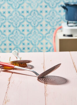 cooking tools arranged on a rustic wooden table