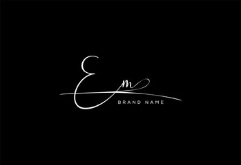 EM letter beauty cursive handwriting logo.
