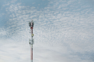 Signal tower or Mobile phone tower .Global connection and internet network concept.on blue sky,Telecommunication tower.