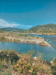 Fototapeta premium River Flows Around Sandy Peninsula