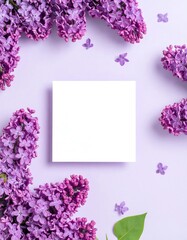 Lilac flowers frame a blank square notecard