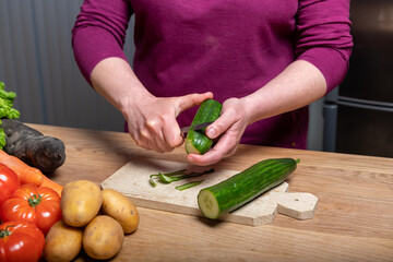 Woman Preparing a Healthy Meal with Fresh Vegetables in the Kitchen
