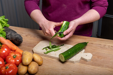 Woman Preparing a Healthy Meal with Fresh Vegetables in the Kitchen