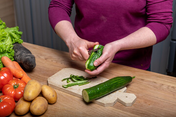 Woman Preparing a Healthy Meal with Fresh Vegetables in the Kitchen
