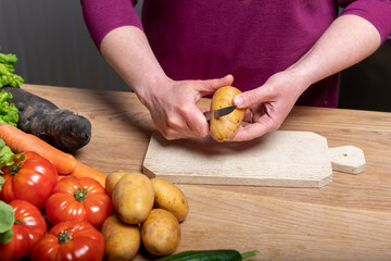 Woman Preparing a Healthy Meal with Fresh Vegetables in the Kitchen