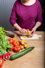 Woman Preparing a Healthy Meal with Fresh Vegetables in the Kitchen