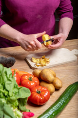 Woman Preparing a Healthy Meal with Fresh Vegetables in the Kitchen