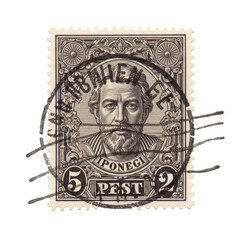 Obraz premium Vintage postage stamp depicting a bearded man with intricate design details and postmark
