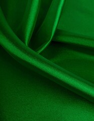 Deep emerald green silk drapes in folds