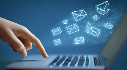 Sending emails with a laptop, digital communication concept.