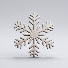 White snowflake decoration with textured surface on gray background