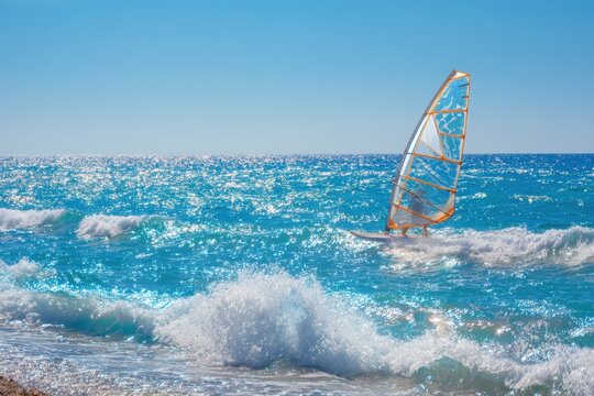 A Wind Surfer Riding the Waves in a Bright Blue Ocean Under Clear Skies with Sparkling Sunlight Reflecting on the Water Surface Near Sandy Beach - Powered by Adobe