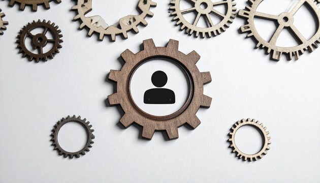 Human Resources in the Cogwheel: A conceptual shot features a prominent cogwheel with a central human silhouette, signifying human resources and workforce management.