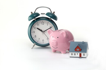 Alarm clock ,model house and model house on white background