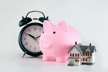 Alarm clock ,model house and model house on white background