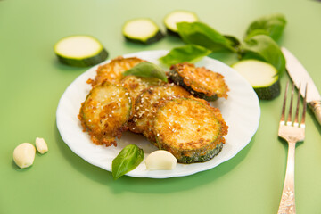 Golden zucchini slices in a crispy homemade breading
