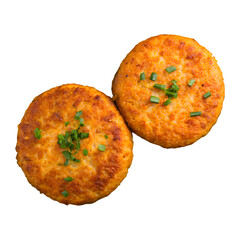 Fototapeta premium Two delicious, golden brown crispy fish cakes, garnished with fresh chives.