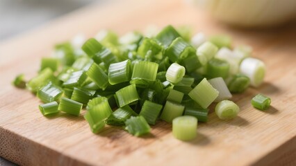 finely chopped green onion on a board close up