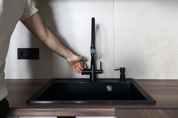 kitchen faucet on a stylish metal sink