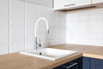 kitchen faucet on a stylish metal sink