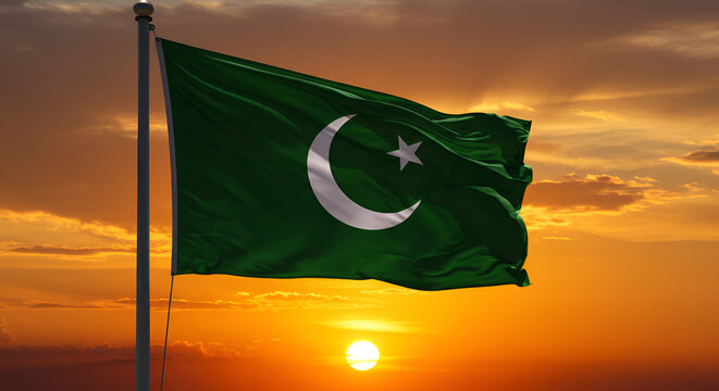 The Majestic Green Standard flag of the Ahmadiyya Muslim Community at Sunset