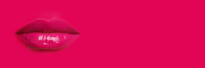 Woman's lips against background matching color of her lipstick. Banner design with space for text