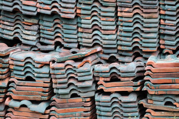 Piles of old clay roof tiles