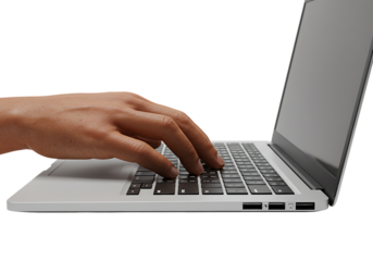 Hand types on laptop keyboard in bright office, showcasing productivity and modern technology, creating a focused and efficient work environment.
