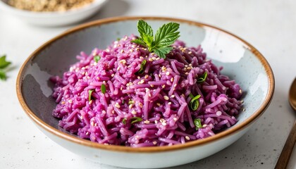 Purple rice salad with sesame seeds and fresh mint in bowl  