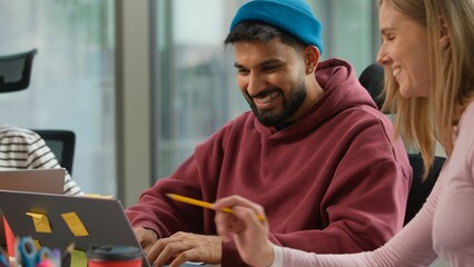 Pensive thinking Arabian informal business man Indian male worker startup founder working with...