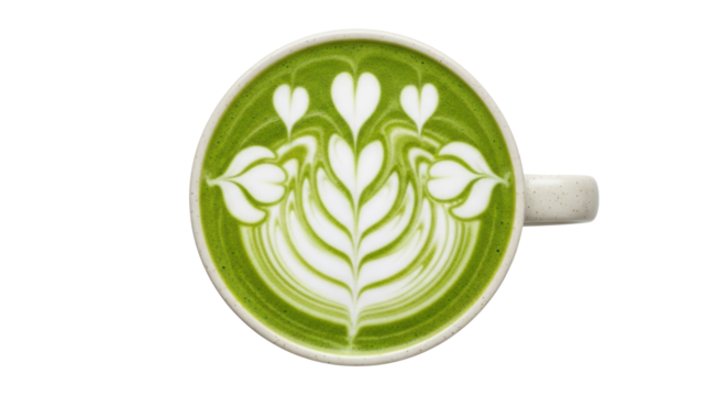 Isolated matcha latte art in a mug with green creamy foam design, top view close-up