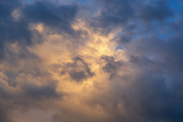 Dark cloud filled from inside with bright sunlight featuring characteristic cloud texture close-up.