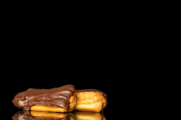 Chocolate sweet eclair, macro, isolated on black  background.