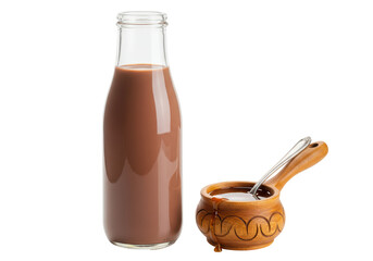 Isolated chocolate milk bottle alongside a wooden bowl with a spoon and some caramel sauce