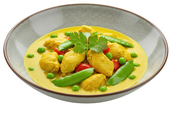 Isolated dish of yellow curry with chicken pieces, snow peas and cilantro sprig