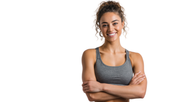 Confident young woman smiling with arms crossed, showcasing an active lifestyle and positive energy.