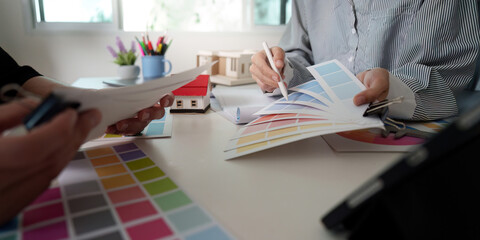 Interior Design Consultation. Engaging in color palette selection for home decor.