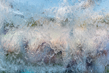 Aqua background. Product space next to clean water streams and water splashes and drops.